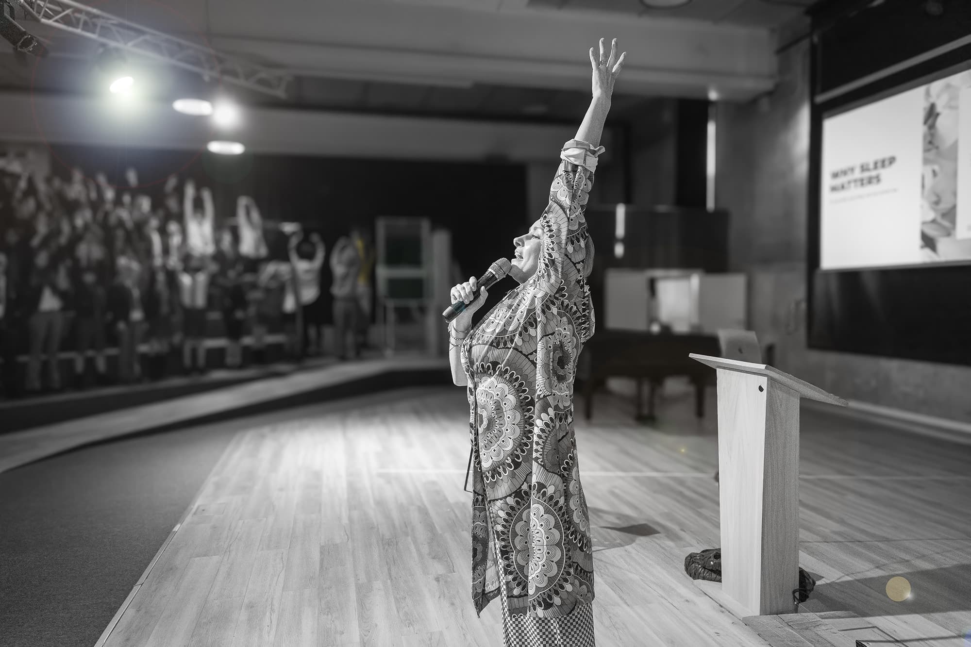 Christina Ribel on stage delivering a sleep talk at The British International School of Marbella