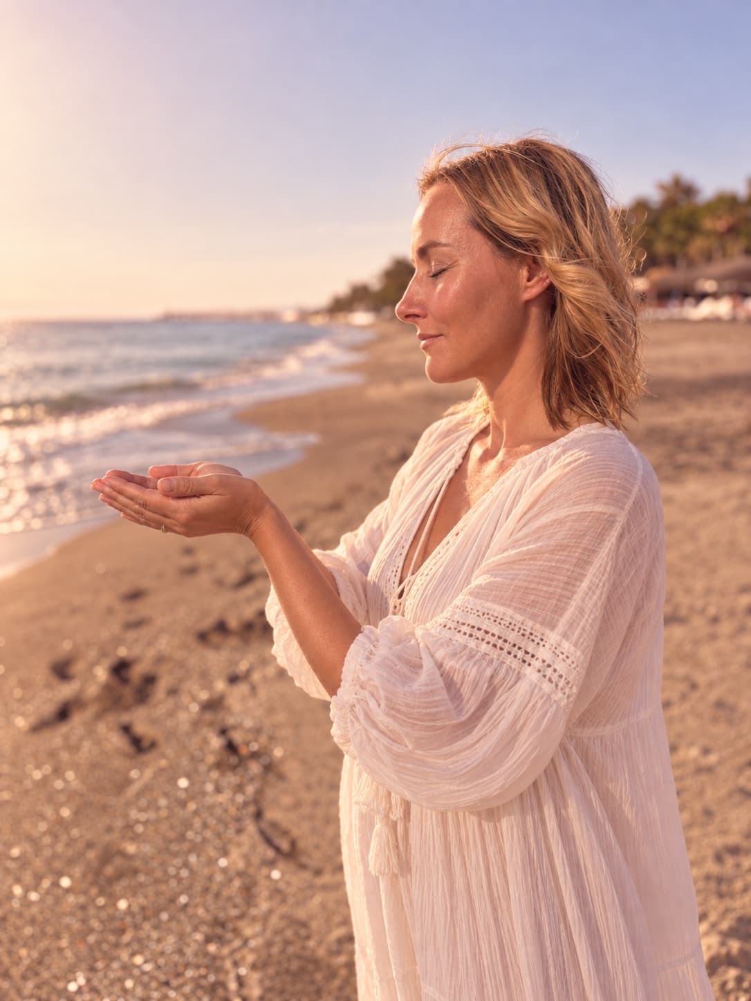 Christina Ribel with cupped hands on the beach